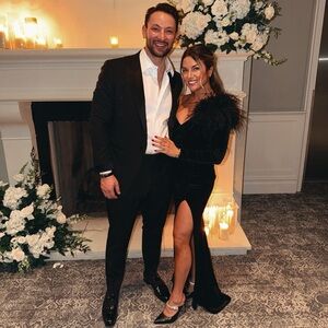 Elegant Black Evening Gown with Feather Detail